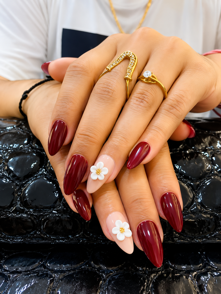 Classic burgundy gel manicure service in Hoshiarpur, Punjab, featuring high-quality deep red polish on professional nail extensions.