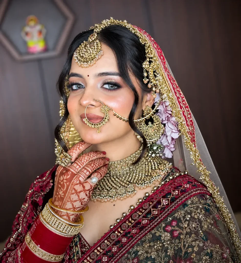 Indian bride with professional bridal makeup and gold jewellery at The Golden Street Salon Hoshiarpur